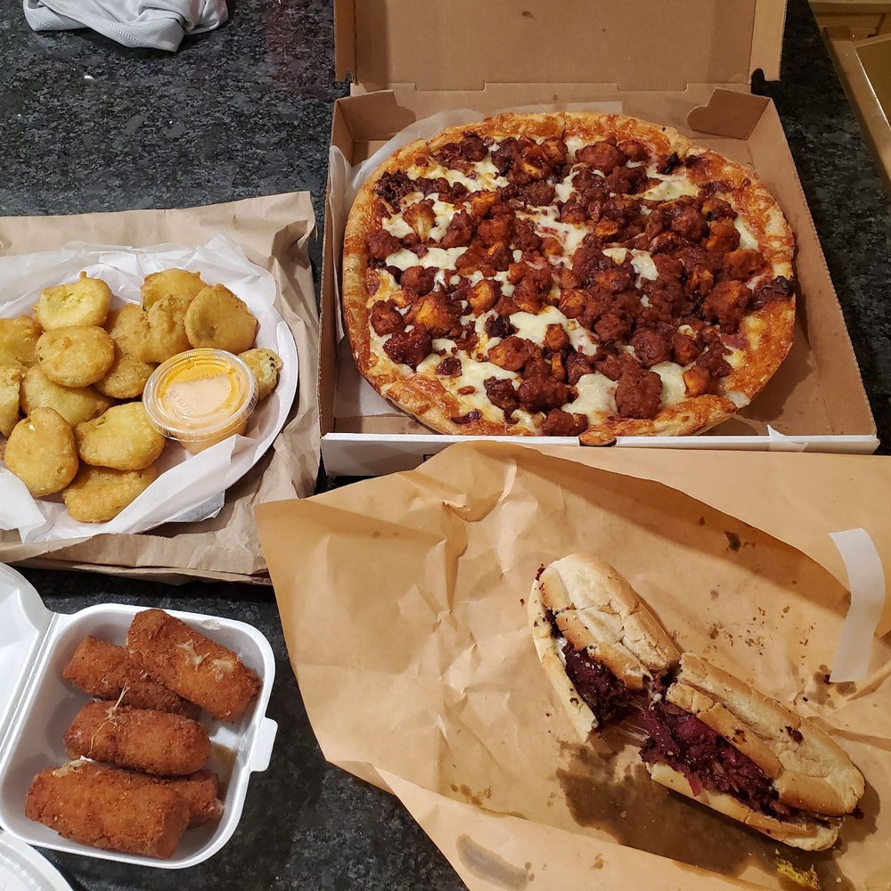 Ordered the Buffaque Pizza with bacon, cheese sticks, fried pickles and a pastrami bomb Ordered the Buffaque Pizza with bacon, cheese sticks, fried pickles and a pastrami bomb
