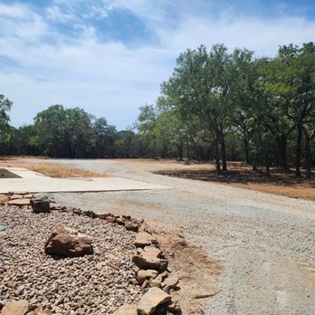 Loving Forestry Mulching and Land Services - Extended driveway, cleared out cedar and brush around house and river rock around septic. - Landscaping Near Me Loving Forestry Mulching and Land Services - Extended driveway, cleared out cedar and brush around house and river rock around septic. - Landscaping Near Me