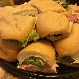 a pile of sandwiches on a plate a pile of sandwiches on a plate