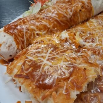 Weck's - Weck's burrito with hash browns. The hash browns were fairly good but the red sauce was poor. Why would they slop it over the potatoes? - Breakfast & Brunch Near Me - Las Cruces, New Mexico