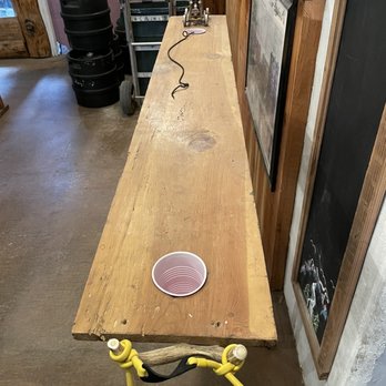 Mr. Grumpy Pants Brewing - a table with a cup on it - Breweries Near Me - Ouray, Colorado Mr. Grumpy Pants Brewing - a table with a cup on it - Breweries Near Me - Ouray, Colorado