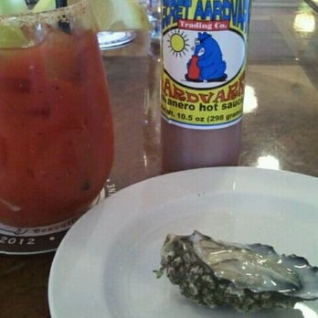 Caves Corvallis - Spicy Bloody Mary with one freshly schucked Oyster - Beer Bar Near Me - Corvallis, Oregon Caves Corvallis - Spicy Bloody Mary with one freshly schucked Oyster - Beer Bar Near Me - Corvallis, Oregon