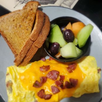 M&M Bar and Cafe - Jalapeño and Cheddar kielbasa omelet, fresh fruit and wheat toast. - Bars Near Me - Butte, Montana M&M Bar and Cafe - Jalapeño and Cheddar kielbasa omelet, fresh fruit and wheat toast. - Bars Near Me - Butte, Montana