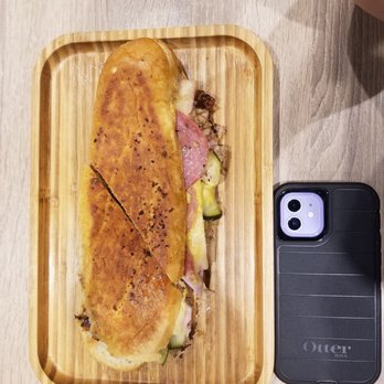 Cubanidad - Ybor Sandwich size (with iPhone 12 for scale reference). - Cuban Near Me - Henderson, Nevada