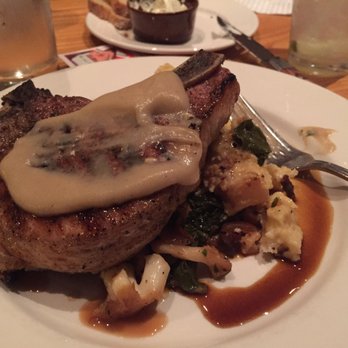 Roots Restaurant and Bar - Carlton Farms Pork Chop. Note that I messed with the sauce on top before the picture. - New American Near Me - Camas, Washington Roots Restaurant and Bar - Carlton Farms Pork Chop. Note that I messed with the sauce on top before the picture. - New American Near Me - Camas, Washington