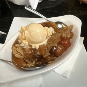 Earle Street Kitchen and Bar - Peach cobbler with ice cream - Bars Near Me - Anderson, South Carolina Earle Street Kitchen and Bar - Peach cobbler with ice cream - Bars Near Me - Anderson, South Carolina