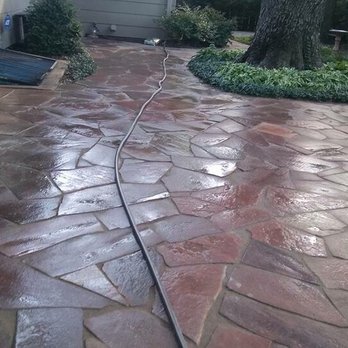 The Rock Guys - a walkway with a hose attached to it - Tree Services Near Me - Wichita, Kansas The Rock Guys - a walkway with a hose attached to it - Tree Services Near Me - Wichita, Kansas