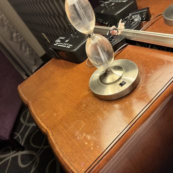 Park Manor Hotel - Sticky and banged up night stand. Lamp shade had stains/ holes in it too - Hotels Near Me - Clifton Park, New York Park Manor Hotel - Sticky and banged up night stand. Lamp shade had stains/ holes in it too - Hotels Near Me - Clifton Park, New York