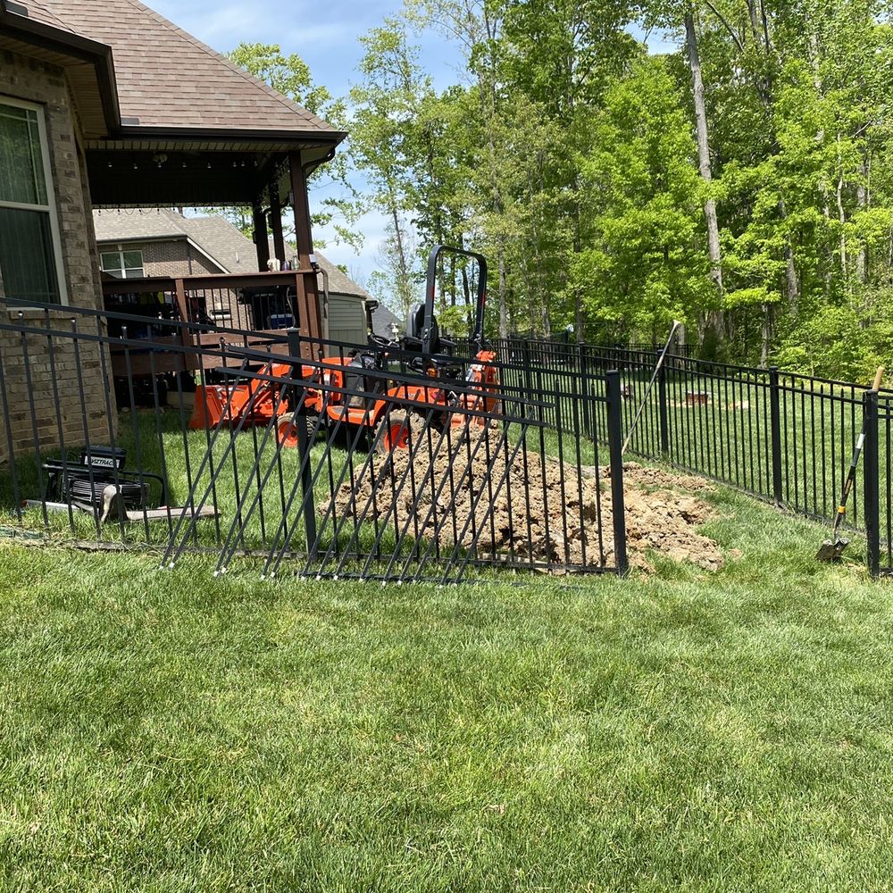 Combat Drain Cleaning & Septic Services - Mini backhoe was able to slip right through the small fence opening - Plumbing Near Me - Clarksville, Tennessee Combat Drain Cleaning & Septic Services - Mini backhoe was able to slip right through the small fence opening - Plumbing Near Me - Clarksville, Tennessee