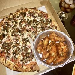 San Clemente Pizza - Sausage, mushrooms and onions pizza with some buffalo sauce wings.