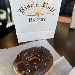 Rise 'n Roll Bakery - Yeast donut with chocolate icing and fall-themed sprinkles at Rise 'n Roll Bakery on November 13, 2023