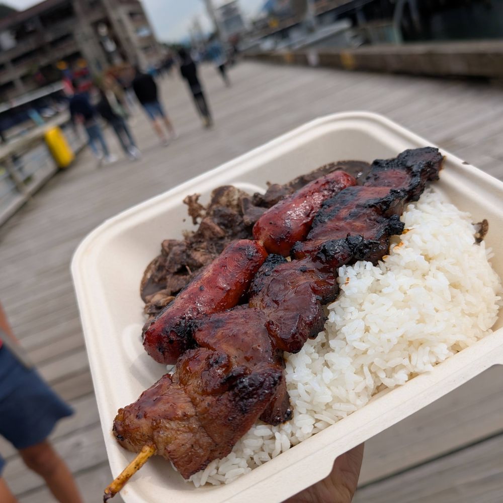 Dinuguan (top, slightly sour pork stewed in blood), BBQ pork skewer (bottom), longanisa (middle, sweet/savory sausage) Dinuguan (top, slightly sour pork stewed in blood), BBQ pork skewer (bottom), longanisa (middle, sweet/savory sausage)