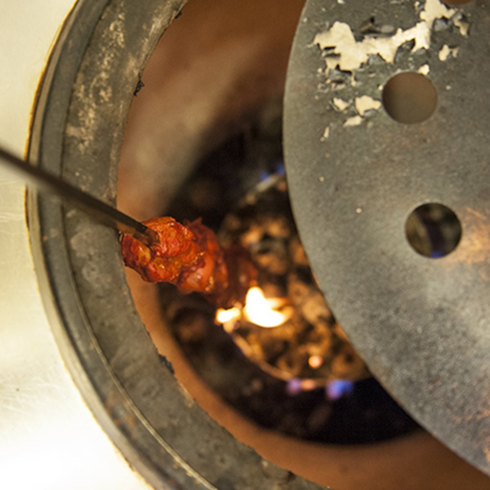 Royal Kabab - Tandoori Chicken being prepped in one of their tandoori ovens - Indian Near Me - Gambrills, Maryland Royal Kabab - Tandoori Chicken being prepped in one of their tandoori ovens - Indian Near Me - Gambrills, Maryland