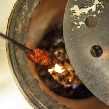 Royal Kabab - Tandoori Chicken being prepped in one of their tandoori ovens - Indian Near Me - Gambrills, Maryland
