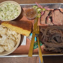 Brisket, pulled pork, mac n cheese, coleslaw and cornbread Brisket, pulled pork, mac n cheese, coleslaw and cornbread