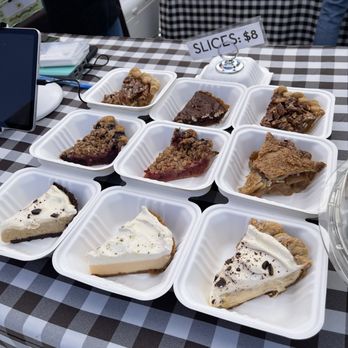 Three Babes Bakeshop - Pie slices for sale at Three Babes Bakeshop at the San Francisco Ferry Plaza Farmers Market in San Francisco. - Desserts Near Me - San Francisco, California Three Babes Bakeshop - Pie slices for sale at Three Babes Bakeshop at the San Francisco Ferry Plaza Farmers Market in San Francisco. - Desserts Near Me - San Francisco, California