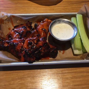 Twin Peaks - Smoked wings minus a few already eaten wings. - Sports Bars Near Me - Winston-Salem, North Carolina