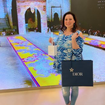 Christian Dior - Posing with my purchase in front of the runway show in India - Men's Clothing Near Me - Honolulu, Hawaii Christian Dior - Posing with my purchase in front of the runway show in India - Men's Clothing Near Me - Honolulu, Hawaii