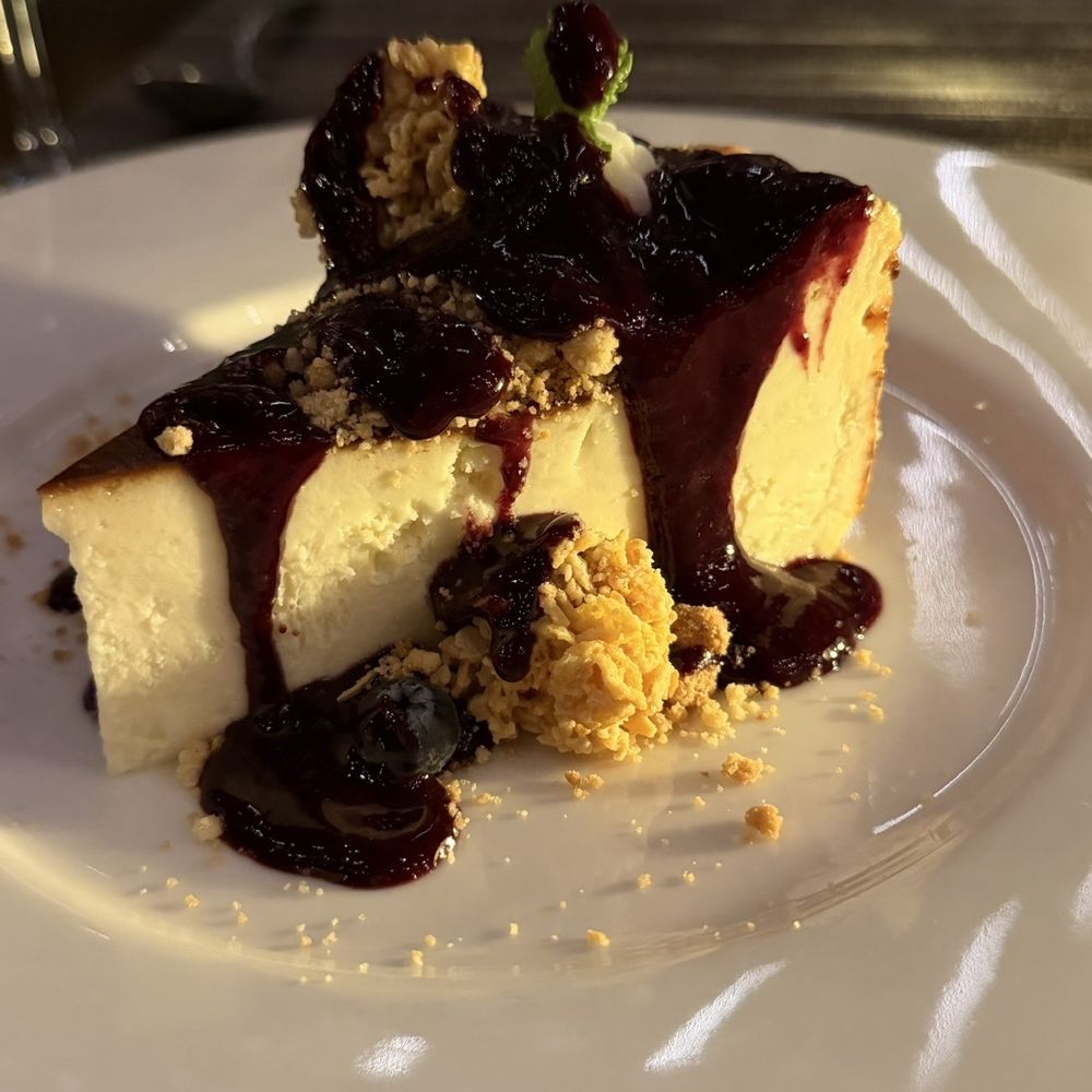 Ambra - BLUEBERRY BASQUE CHEESECAKE Double cream goat cheese, blueberry coulis, cornflake croustillant, berry smoke - Steakhouses Near Me - Mcallen, Texas Ambra - BLUEBERRY BASQUE CHEESECAKE Double cream goat cheese, blueberry coulis, cornflake croustillant, berry smoke - Steakhouses Near Me - Mcallen, Texas