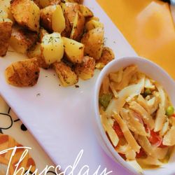 Mi Casita Restaurant - Conch in garlic sauce with sautéed potatoes