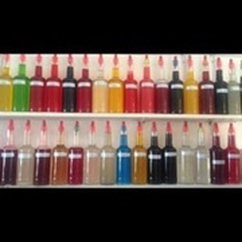 Flavor-Rite - a shelf full of bottles of liquid - Shaved Ice Near Me - Long Beach, Mississippi