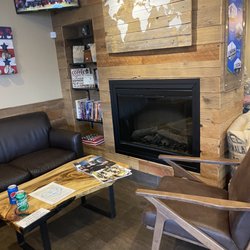 Green Beans Coffee Omaha - Millard - Sitting area with fireplace
