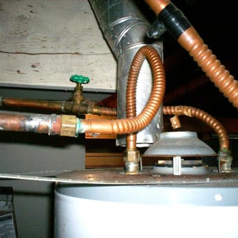 Lasswell Home Inspection - The exhaust vent for this water heater almost lined up. This is one occasions where close isn't ok. - Home Inspectors Near Me Lasswell Home Inspection - The exhaust vent for this water heater almost lined up. This is one occasions where close isn't ok. - Home Inspectors Near Me
