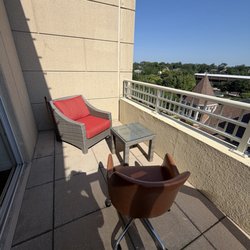 Hotel Indigo Naperville Riverwalk - What kind of hotel offers one chair on a balcony with a king bed? The solution when I asked for another balcony chair.
