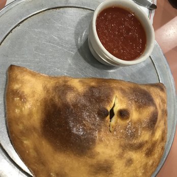 Bravo Pizza & Restaurant - a plate of empanada and a bowl of tomato sauce - Pizza Near Me - Harvard, Illinois Bravo Pizza & Restaurant - a plate of empanada and a bowl of tomato sauce - Pizza Near Me - Harvard, Illinois