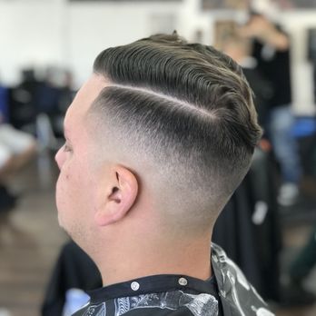 Under The Blade - Comb-over part line with a mid fade. - Barbers Near Me - South Gate, California Under The Blade - Comb-over part line with a mid fade. - Barbers Near Me - South Gate, California