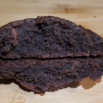 Three Chip Confections - a half eaten chocolate cookie - Desserts Near Me - Land O' Lakes, Florida