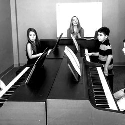 Accelerate Piano has a maximum of 6 students per lesson. Students move through their books more quickly.