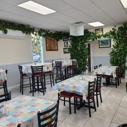 Cuban Island Restaurant - The left dining area of the restaurant and the entrance to the bathrooms.