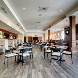 Suite Fire Bar + Grille - Suite Fire Bar + Grille features cozy seating areas, a community table and multiple flat screen TVs.