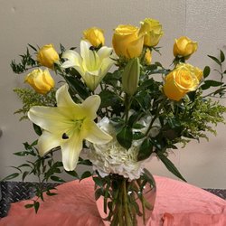Blossoms Fine Flowers - A dozen yellow roses... Not your typical arrangement