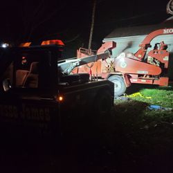 Jesse James Towing & Recovery - Had to lift a chipper to fix the tire