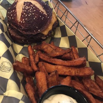 Eddie Burger + Bar - Bison burger-cheddar cheese, pickles, chipotle mayo, garlic aioli, pretzel bun. Sweet potato fries. - Burgers Near Me - Banff, Alberta Eddie Burger + Bar - Bison burger-cheddar cheese, pickles, chipotle mayo, garlic aioli, pretzel bun. Sweet potato fries. - Burgers Near Me - Banff, Alberta