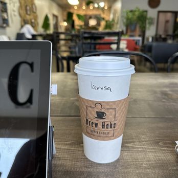 Brew Haha Coffeehouse - a cup of coffee and a laptop - Coffee & Tea Near Me - Overland Park, Kansas Brew Haha Coffeehouse - a cup of coffee and a laptop - Coffee & Tea Near Me - Overland Park, Kansas