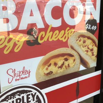 Shipley Do-Nuts - A promotional sign for bacon and cheese kolaches at Shipley Do-Nuts in Carrollton, TX, featuring images of the stuffed pastries and pricing information. - Donuts Near Me - Carrollton, Texas