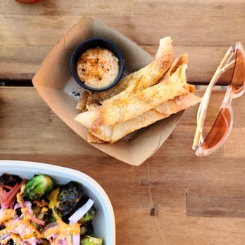 Sunny's Backyard - Wonton cheese sticks and Brussels sprouts salad - Pubs Near Me - Austin, Texas