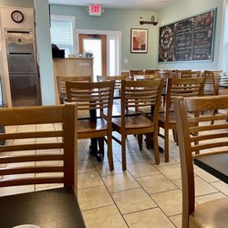 Interior of restaurant from back looking towards front entrance. Clean, decent number of tables for how small a size this place is