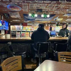 Joe's Log Cabin Tavern & Steak House - ..or sit up to the bar and do it all!