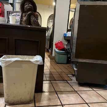 The Brownstone Cafe - a trash can on the floor - New American Near Me - Fullerton, California