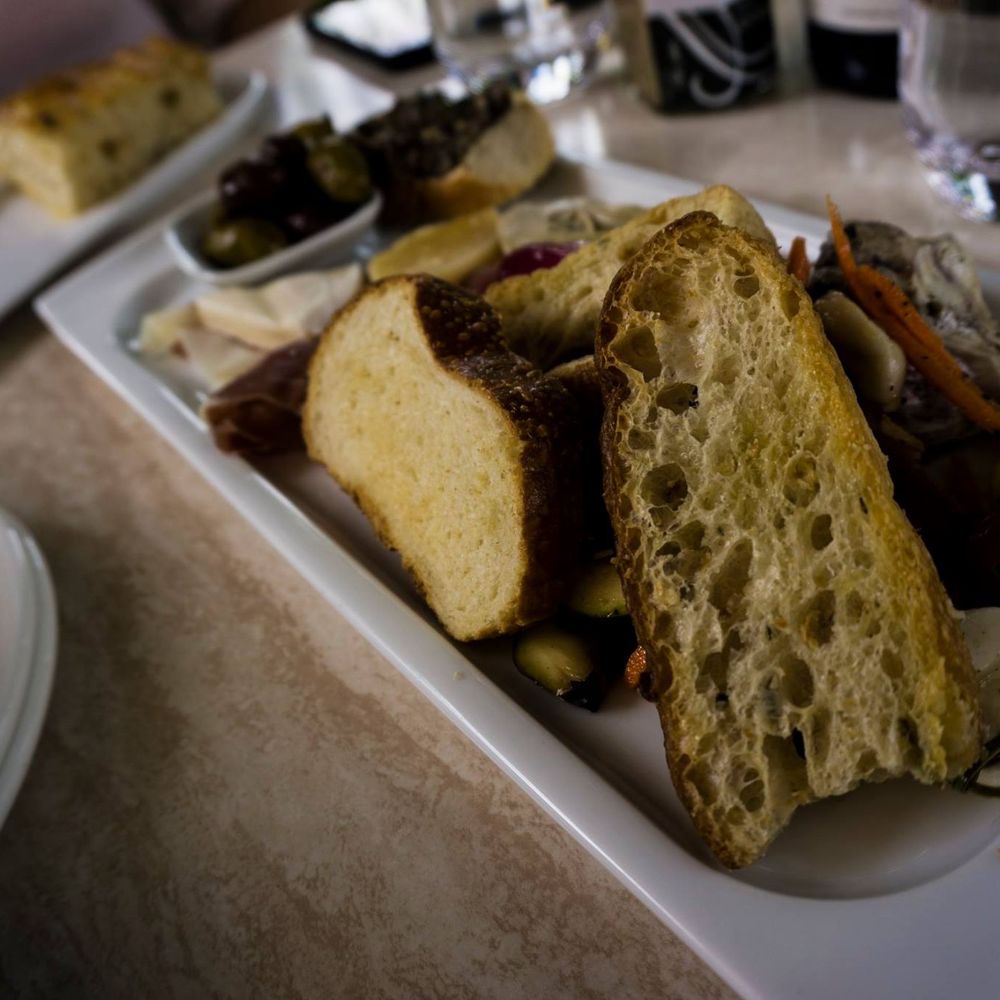 Lake Breeze Vineyards - a plate of bread and vegetables - Wineries Near Me - Naramata, British Columbia Lake Breeze Vineyards - a plate of bread and vegetables - Wineries Near Me - Naramata, British Columbia