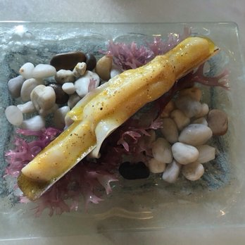 Bodega 1900 - Delectable navaja (razor clam) presented on pebbles and seaweed - Tapas/Small Plates Near Me - Barcelona, B