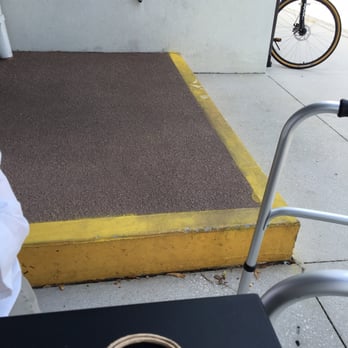 Starbucks - Handicapped access at Starbucks - note the large step down - no ramp as ADA PRESCRIBES RIGHTLY. - Coffee & Tea Near Me - St Augustine, Florida