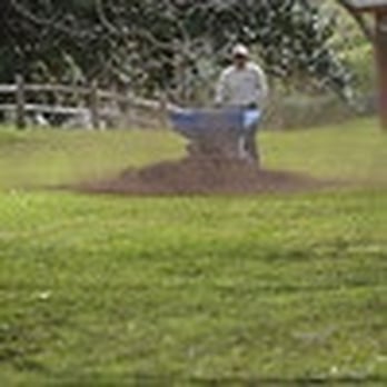 Dillo Dirt - a man using a wheelbarrow - Landscaping Near Me - Round Rock, Texas Dillo Dirt - a man using a wheelbarrow - Landscaping Near Me - Round Rock, Texas