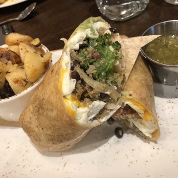 First Watch - Fantastic potatoes!  SoCal-Chicken, avocado, kale, black beans, egg whites, onions, and insane salsa verde!!! - Breakfast & Brunch Near Me - Winston-Salem, North Carolina