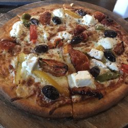Zio Restaurant - Gluten free pizza with bell peppers, olives, tomatoes and goat cheese