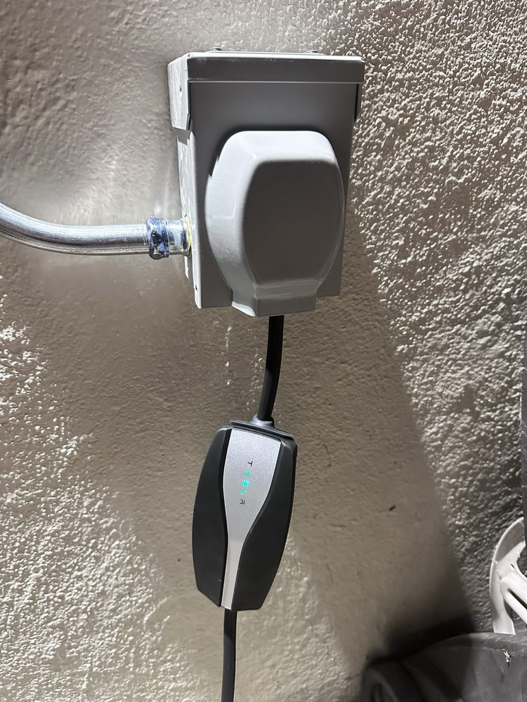 Slide of Tesla Electrical Services